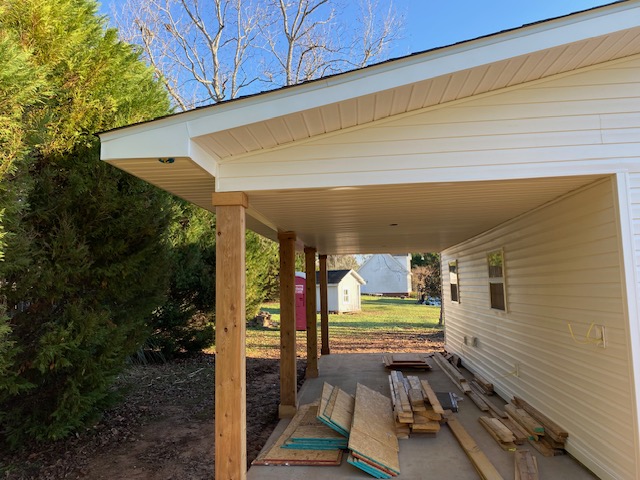 New carport addition framed onto an existing home