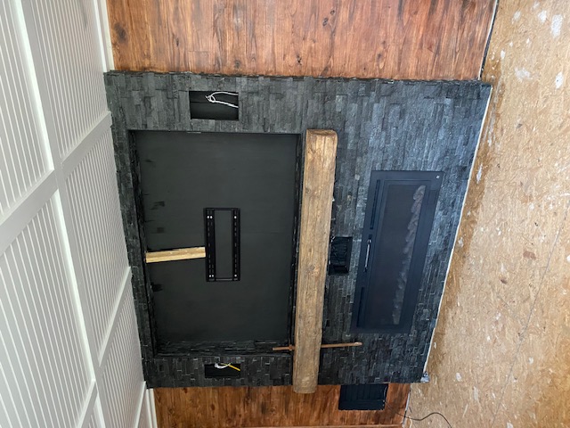 Stacked-stone fireplace feature wall, work in progress