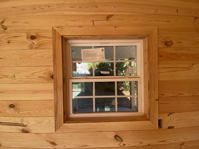 Knotty pine window trim, full-room view