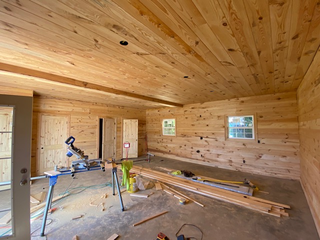 Pine-paneled room addition nearing completion
